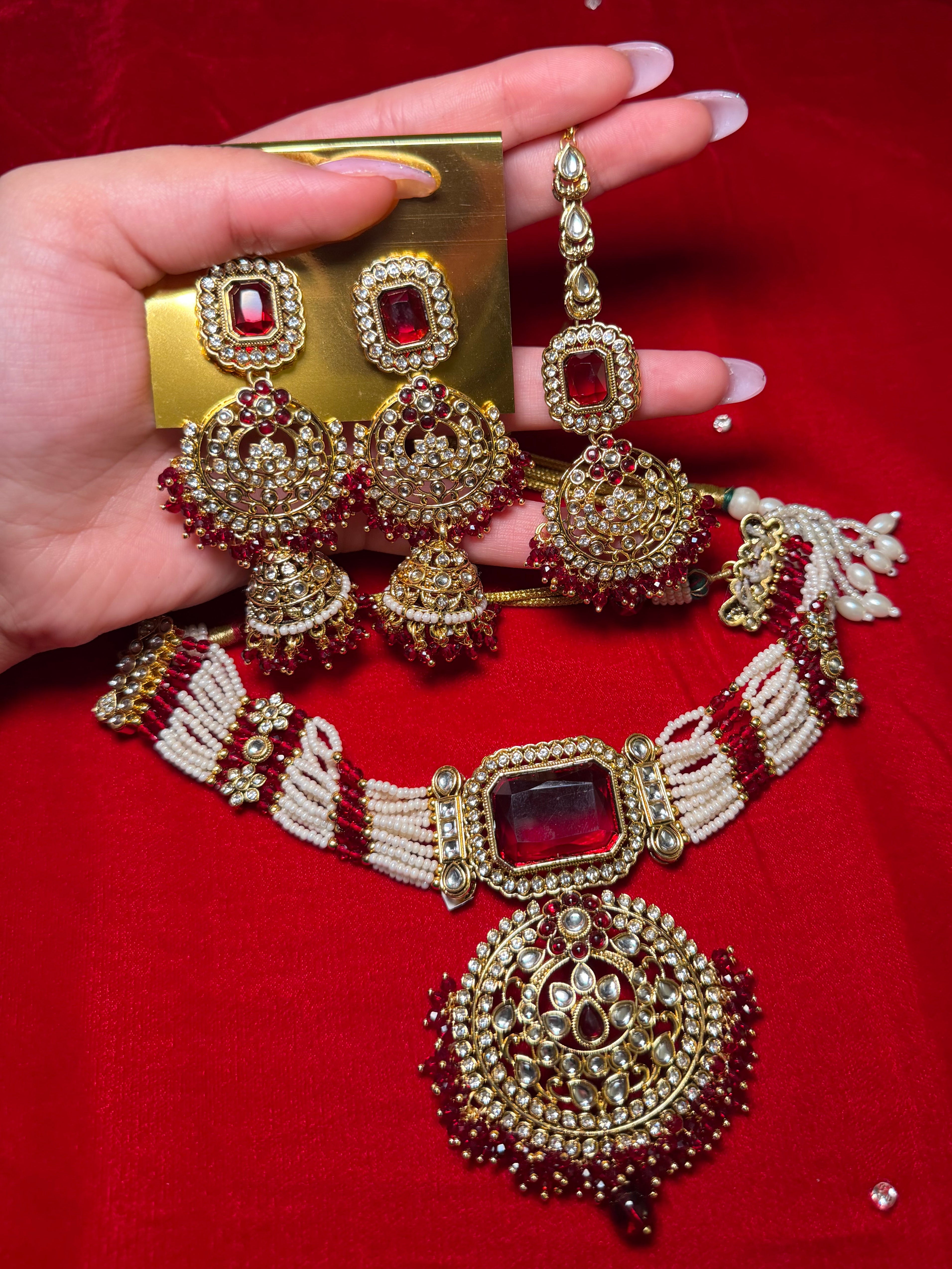 Maroon with white pearls choker set with jhumka earrings & tikka