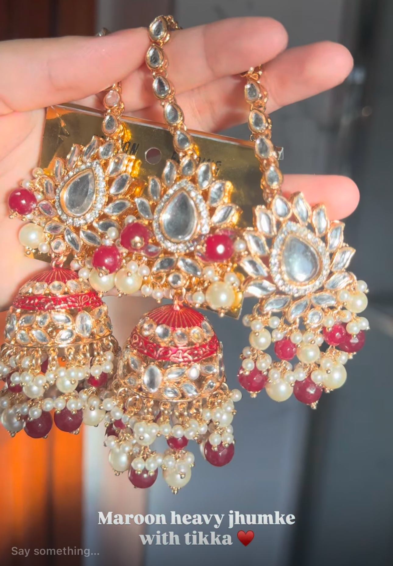 Oversized maroon jhumka with tikka